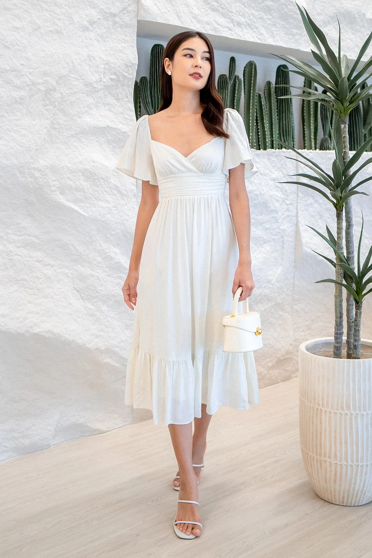 CECE FLUTTERS MAXI DRESS IN CREAM WHITE